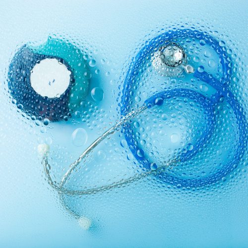 asthma inhaler stethoscope medicine through water drop background. medical treatment