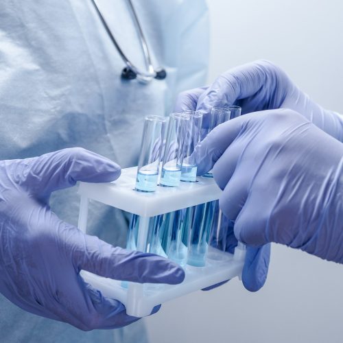 Two medical scientists hadling test tubes